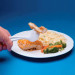 The Eating Tool Dining Aid can be used to cut and eat an entire meal with one hand. 